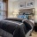 Well lit bedroom with plush carpet