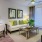 Living room with desk area and large windows