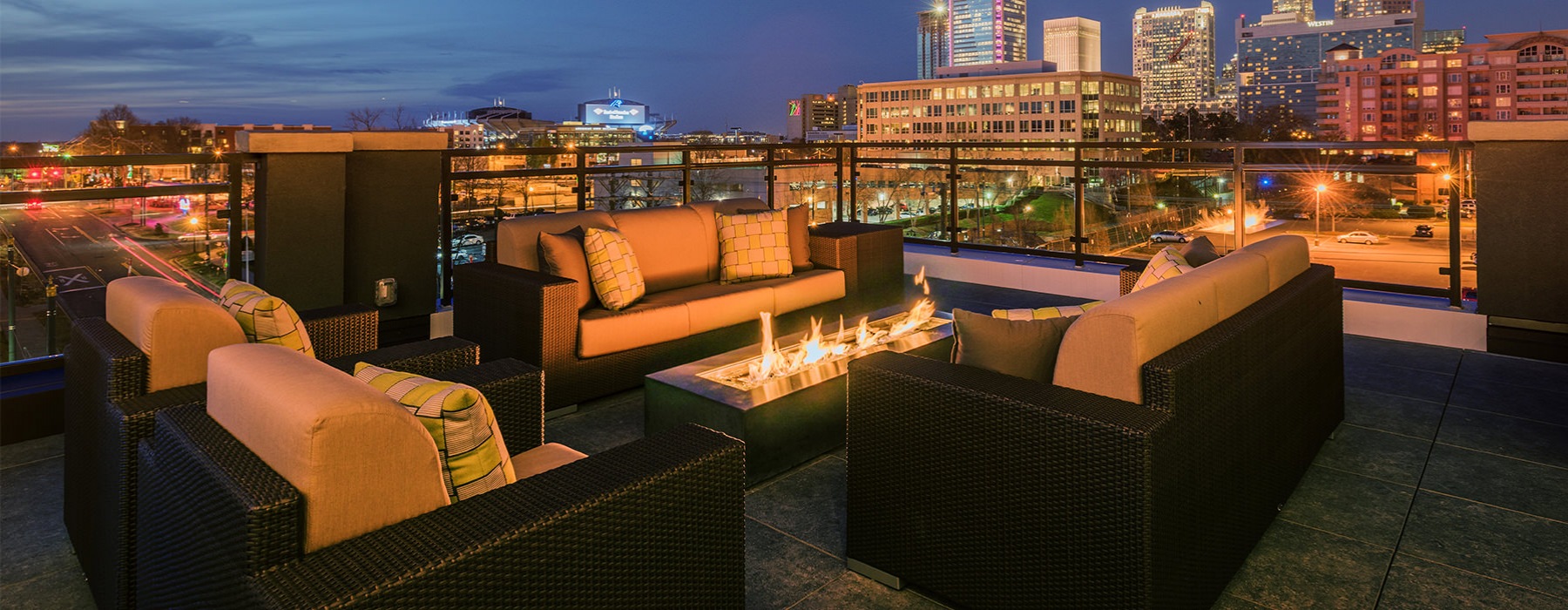 Rooftop Terrace with firepit at night.